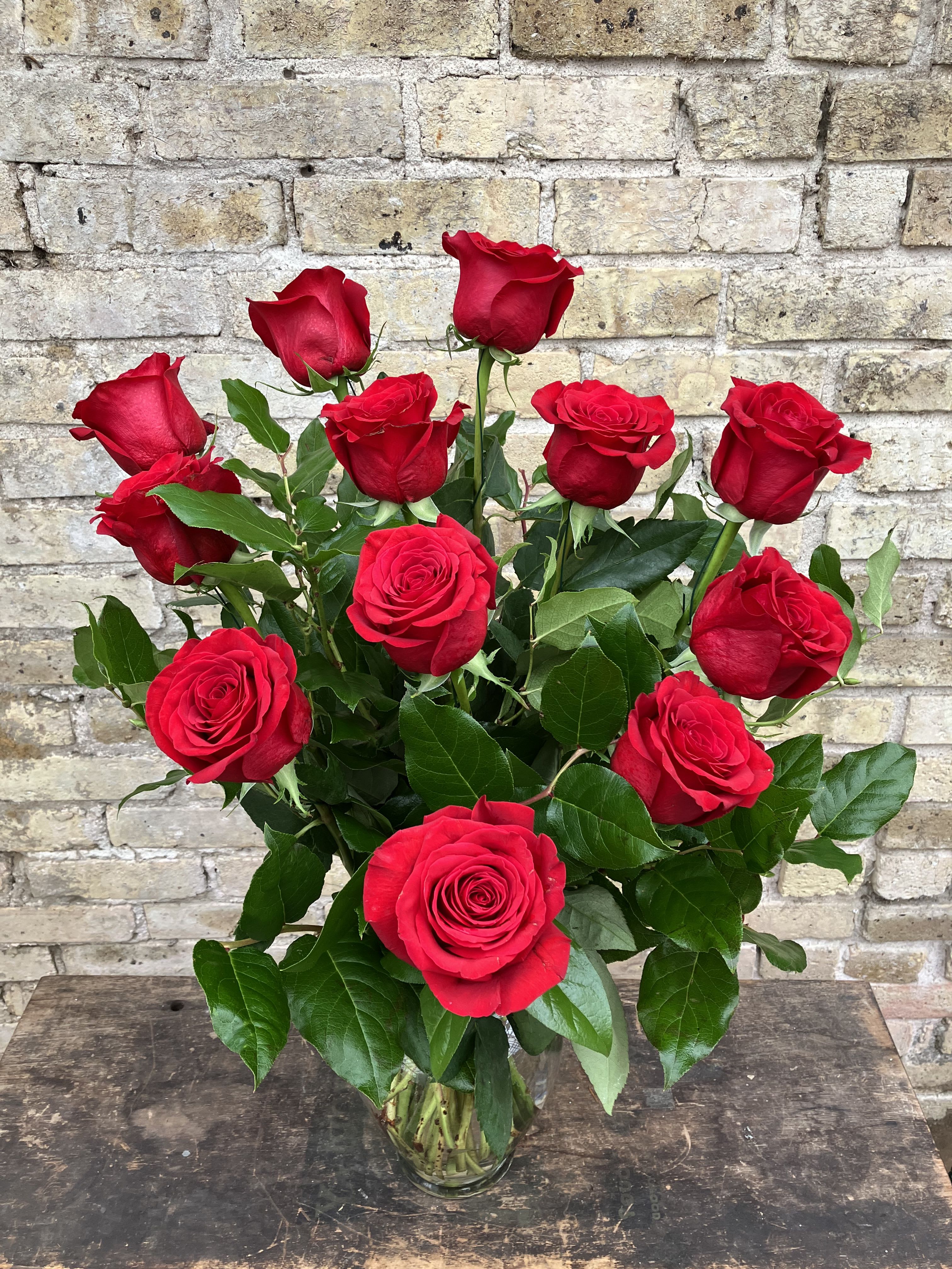 Bouquet of red roses in a clear glass vase