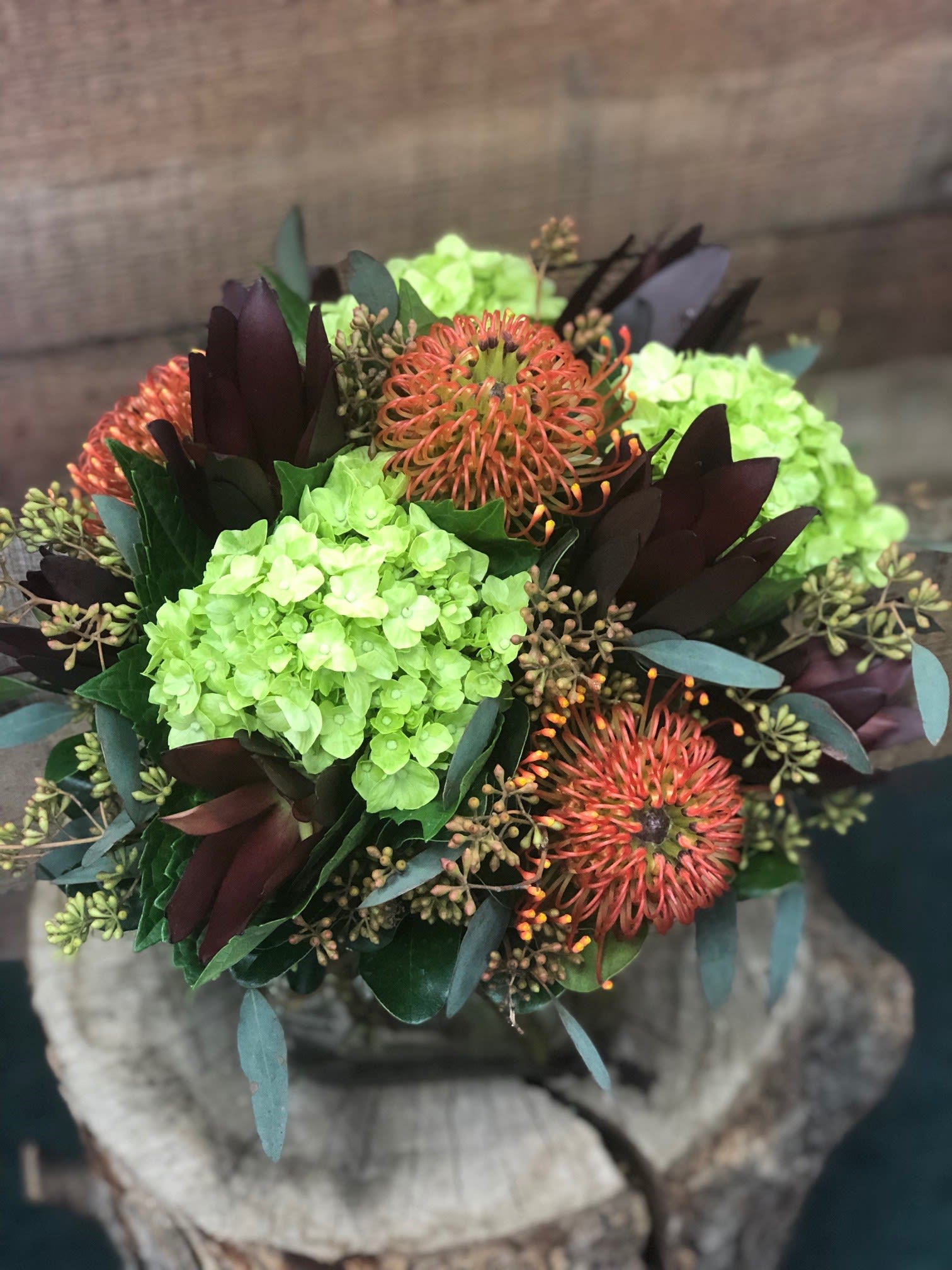 Bouquet with lime hydrangeas and orange pincushion blooms