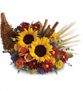 Sunflower and rose arrangement with daisies in a woven basket