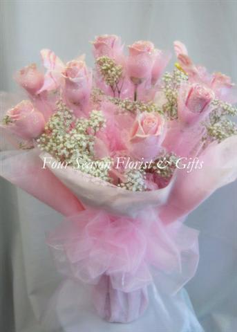 Hong Kong Style Roses - Light Pink - Light pink Hong Kong style roses. 1/2 Dozen $150 1 Dozen $220 2 Dozen $430 Prices above include vase.   *** GRADUATION HONG KONG STYLE ROSES, PLEASE PHONE-IN  Hong Kong Style Roses WRAPPED ( without a vase) will come with water tubes/water pouch.   Recommended for graduations!  Additional $20  