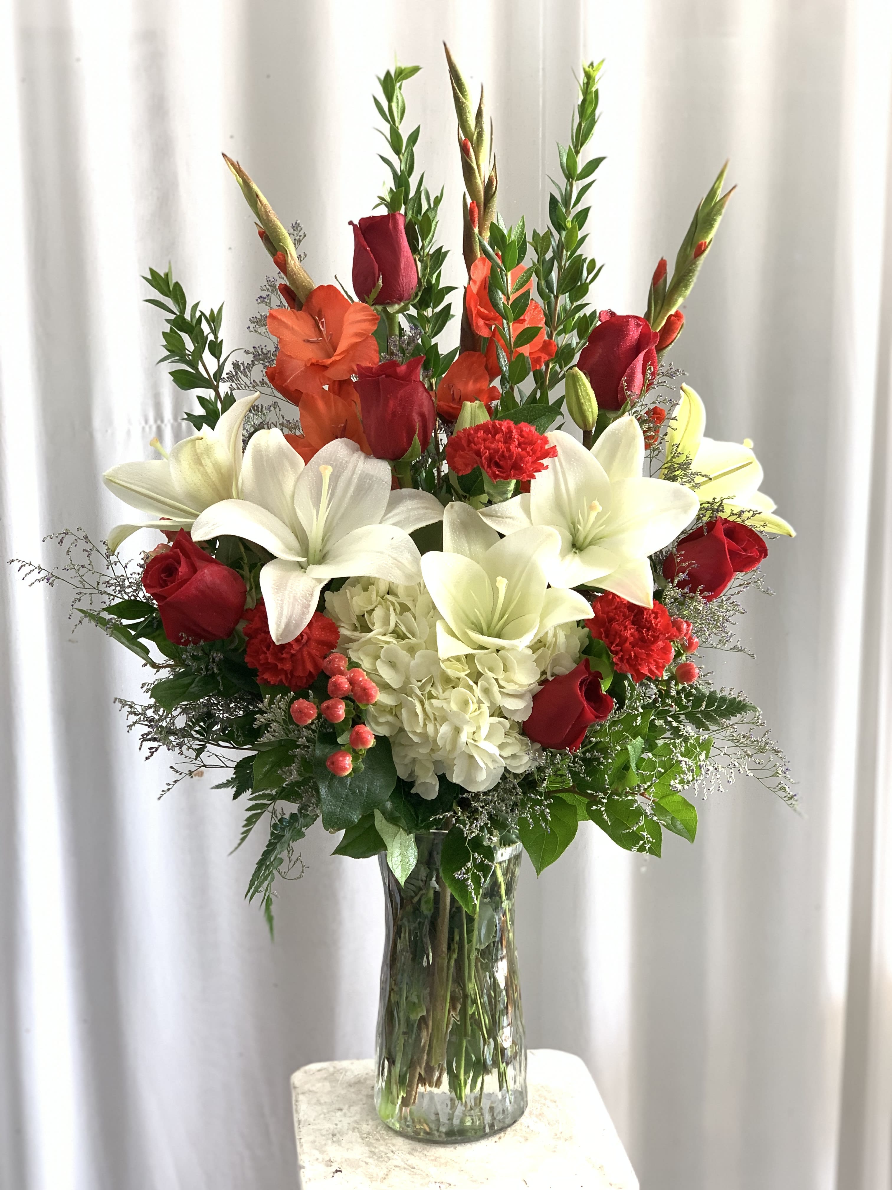 Thinking of You  - Traditional vase arrangement of mixed flowers of Red Roses, Hydrangeas, Tiger Lilies, Gladiolus and Carnations.  