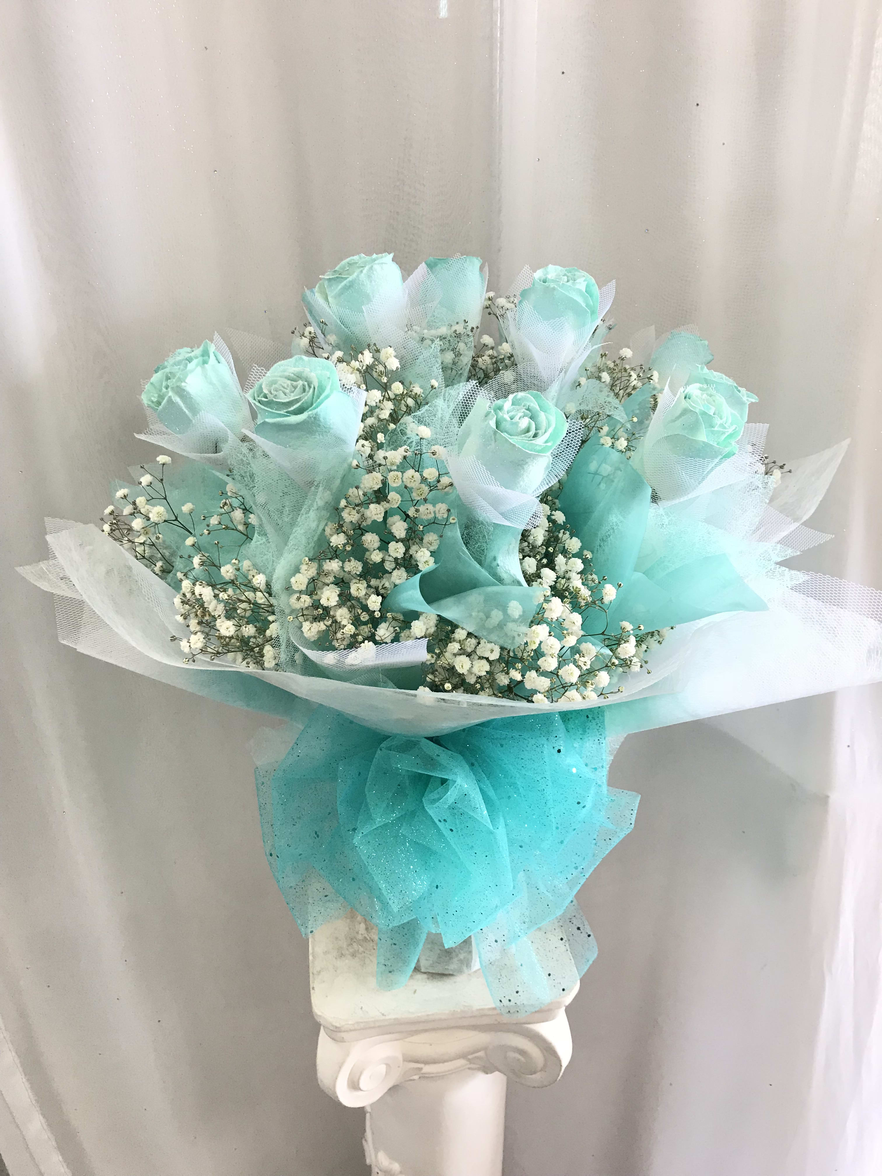 Hong Kong Style Roses - Tiffany Blue  - Tiffany Blue Hong Kong style roses. 1/2 Dozen $150 1 Dozen $220 2 Dozen $430 Prices above include vase.   *** GRADUATION HONG KONG STYLE ROSES, PLEASE PHONE-IN  Hong Kong Style Roses WRAPPED ( without a vase) will come with water tubes/water pouch.   Recommended for graduations!  Additional $20   