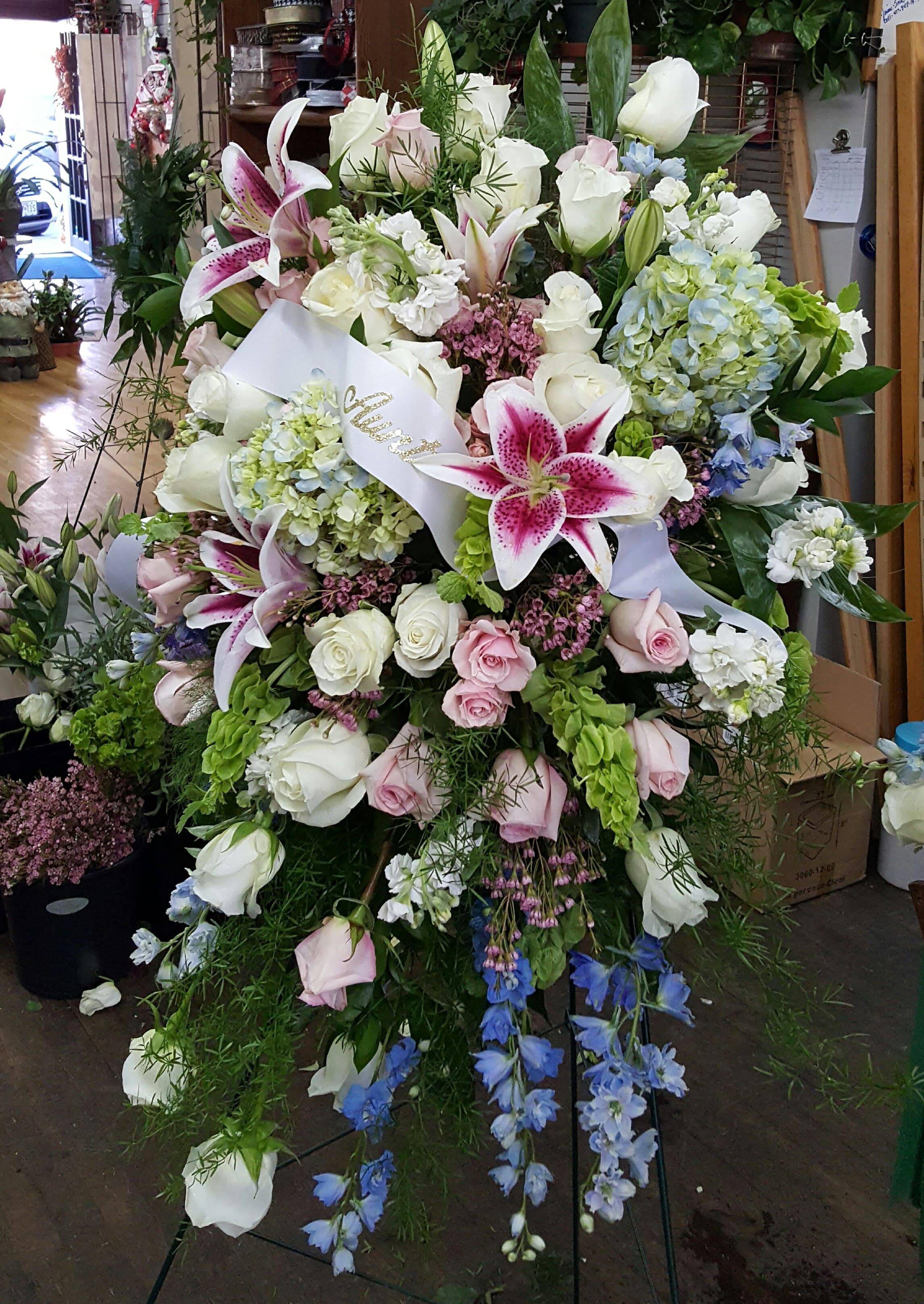 Soft Garden Easel Spray  - A pastel mixture of garden blooms provides soft moments and comfort. 35"W x 46"H