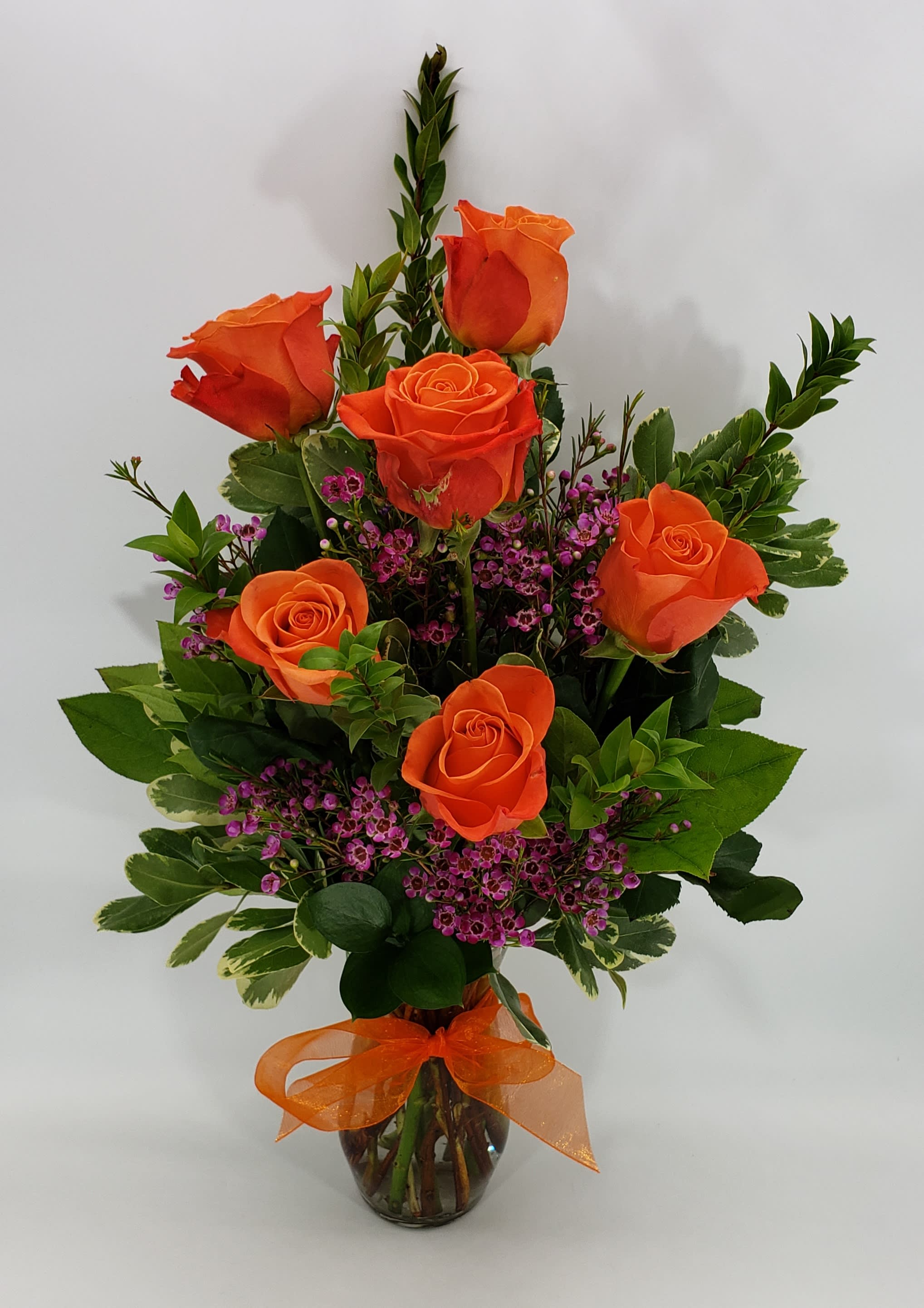Six Pack Orange Crush Roses - 6 Orange Crush roses with waxflower. Approximately 20 inches tall.