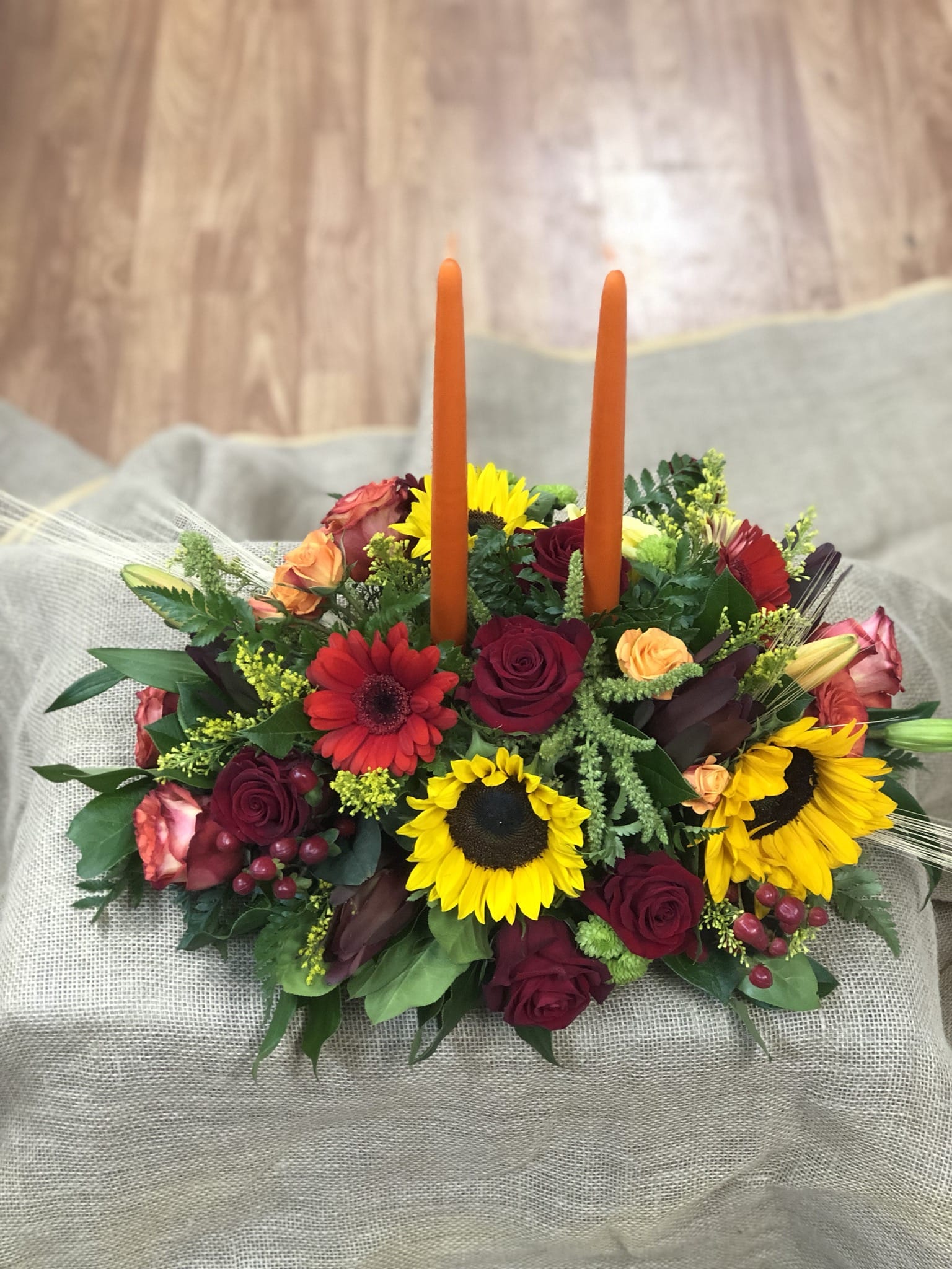 thanksgiving center piece - This cemetery piece will bring light to your thanksgiving feast with its 2 candles and vibrant  orange and red colors, with roses and daisies to make any room beautiful. 