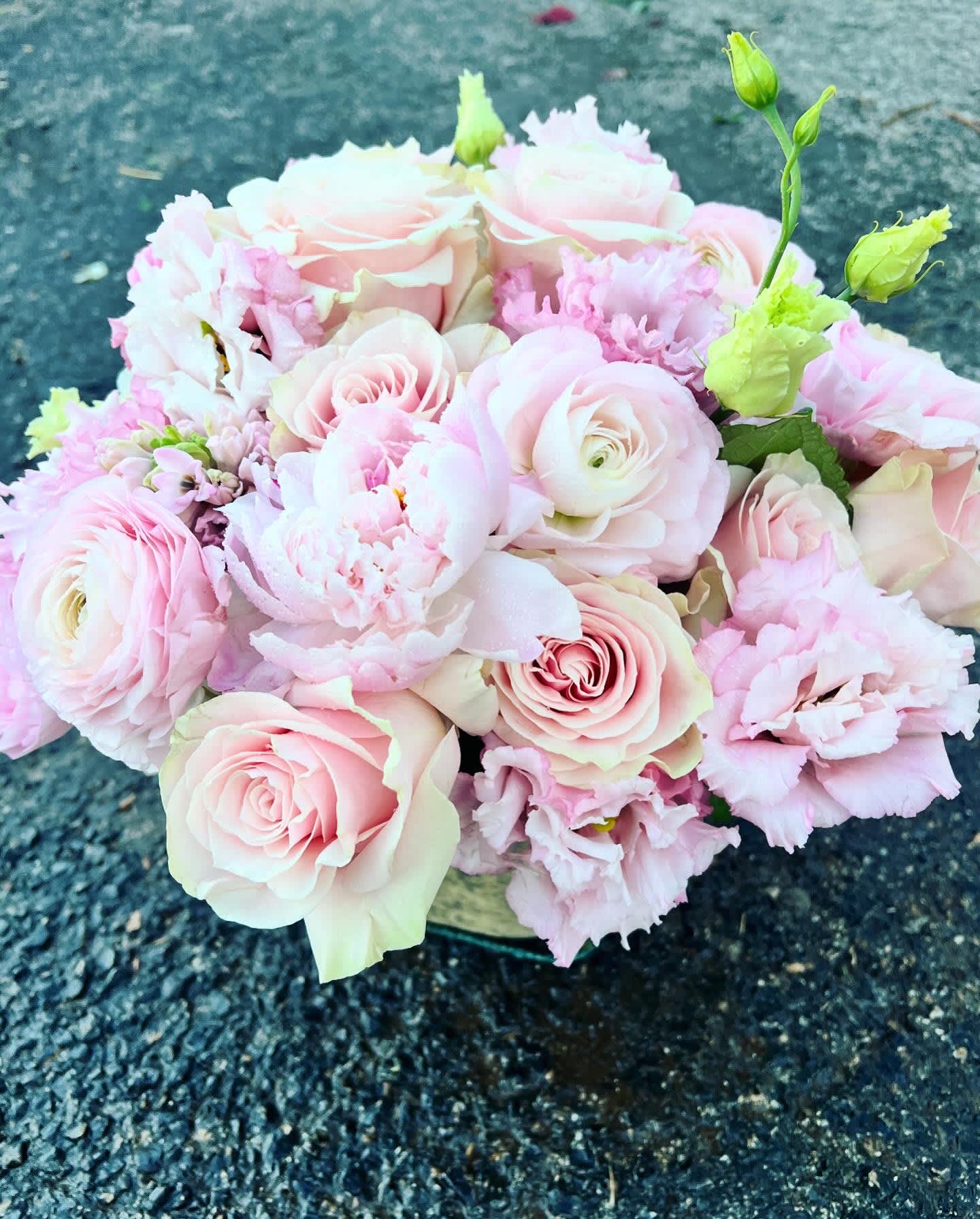 Bouquet of pale pink roses and ruffled pink flowers