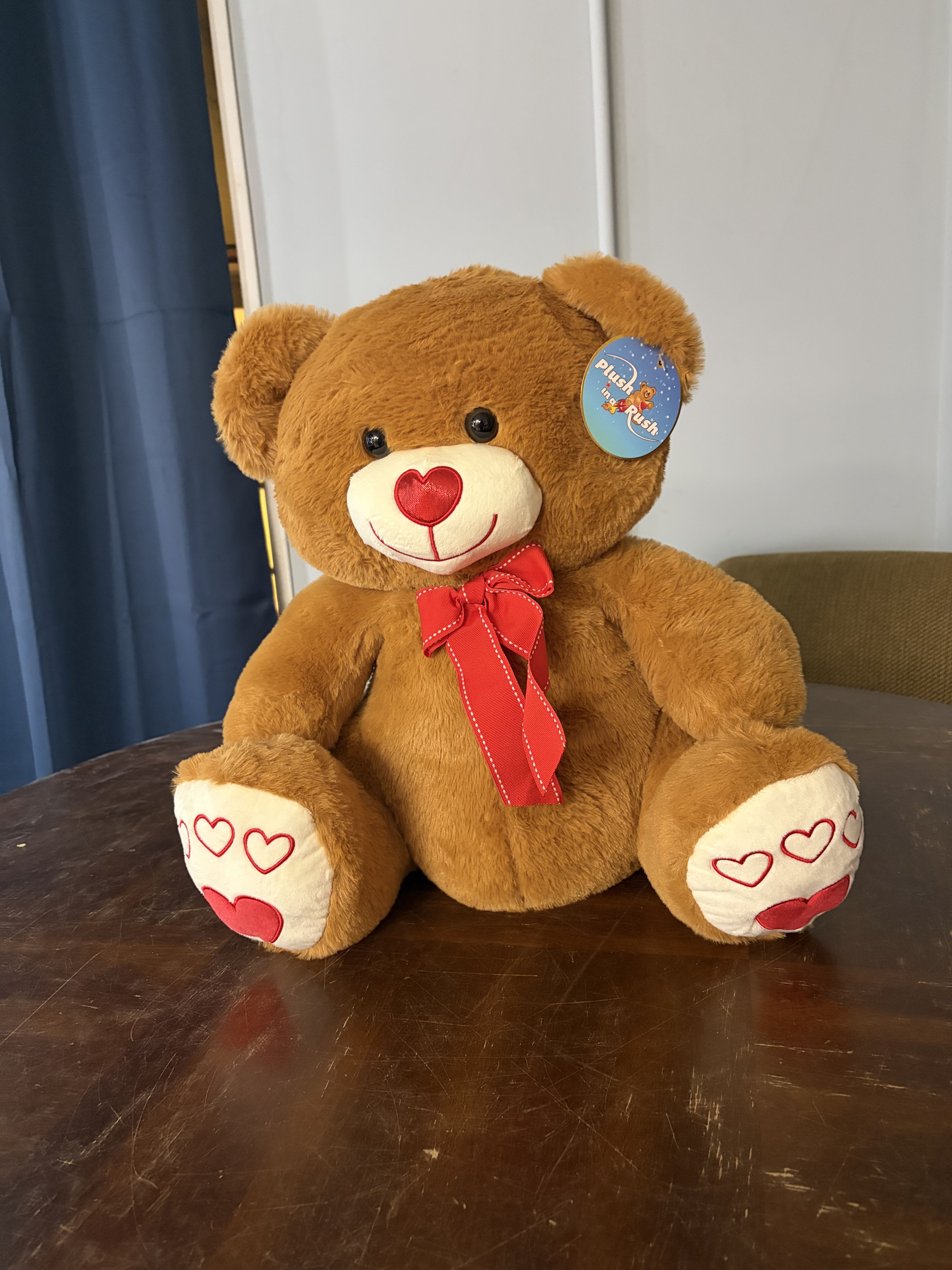 Valentine's Bear - 19.5" Brown valentine's bear with heart on paw feet, heart nose, red bow.
