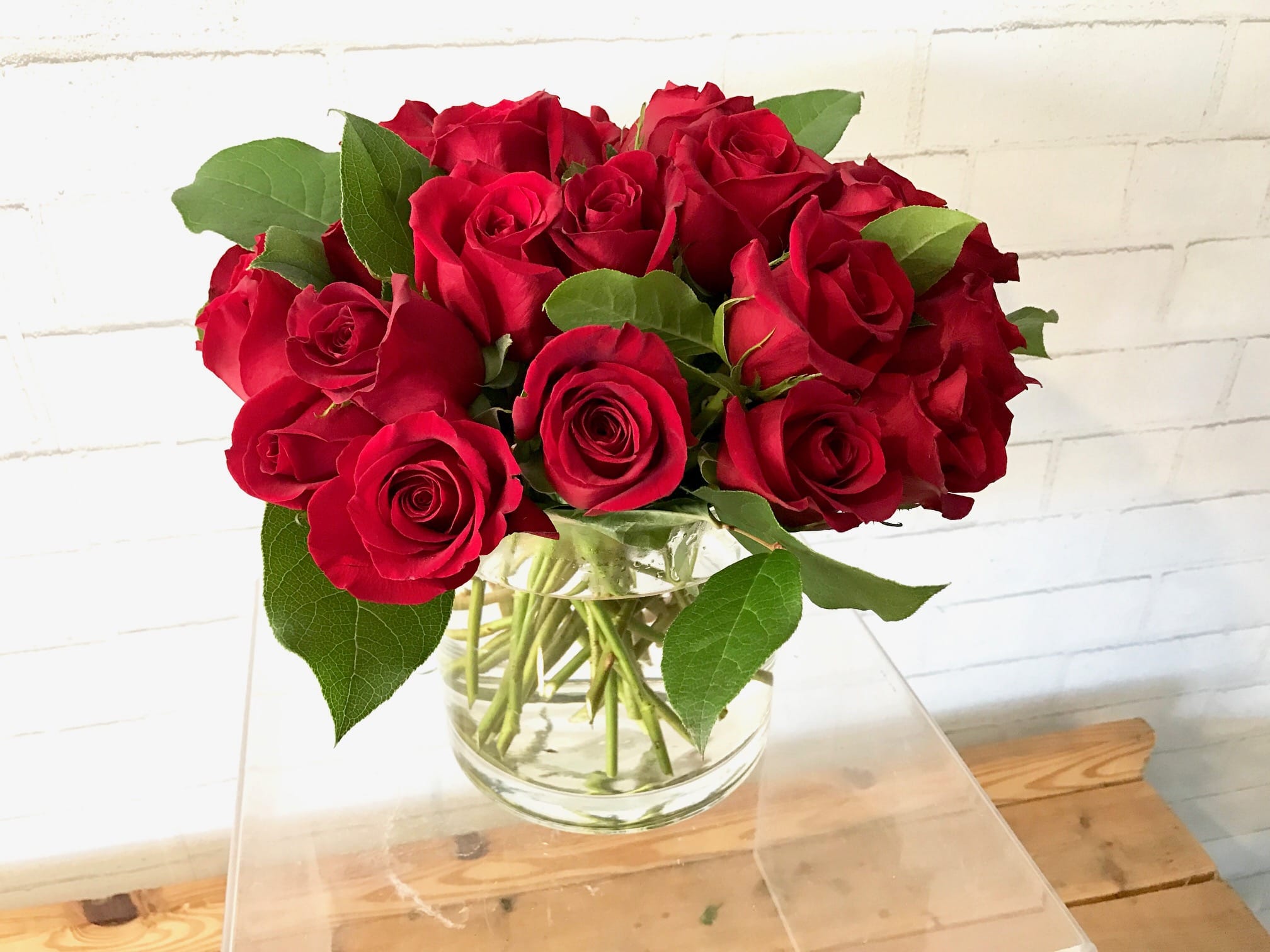 Bouquet of red roses in a clear glass vase