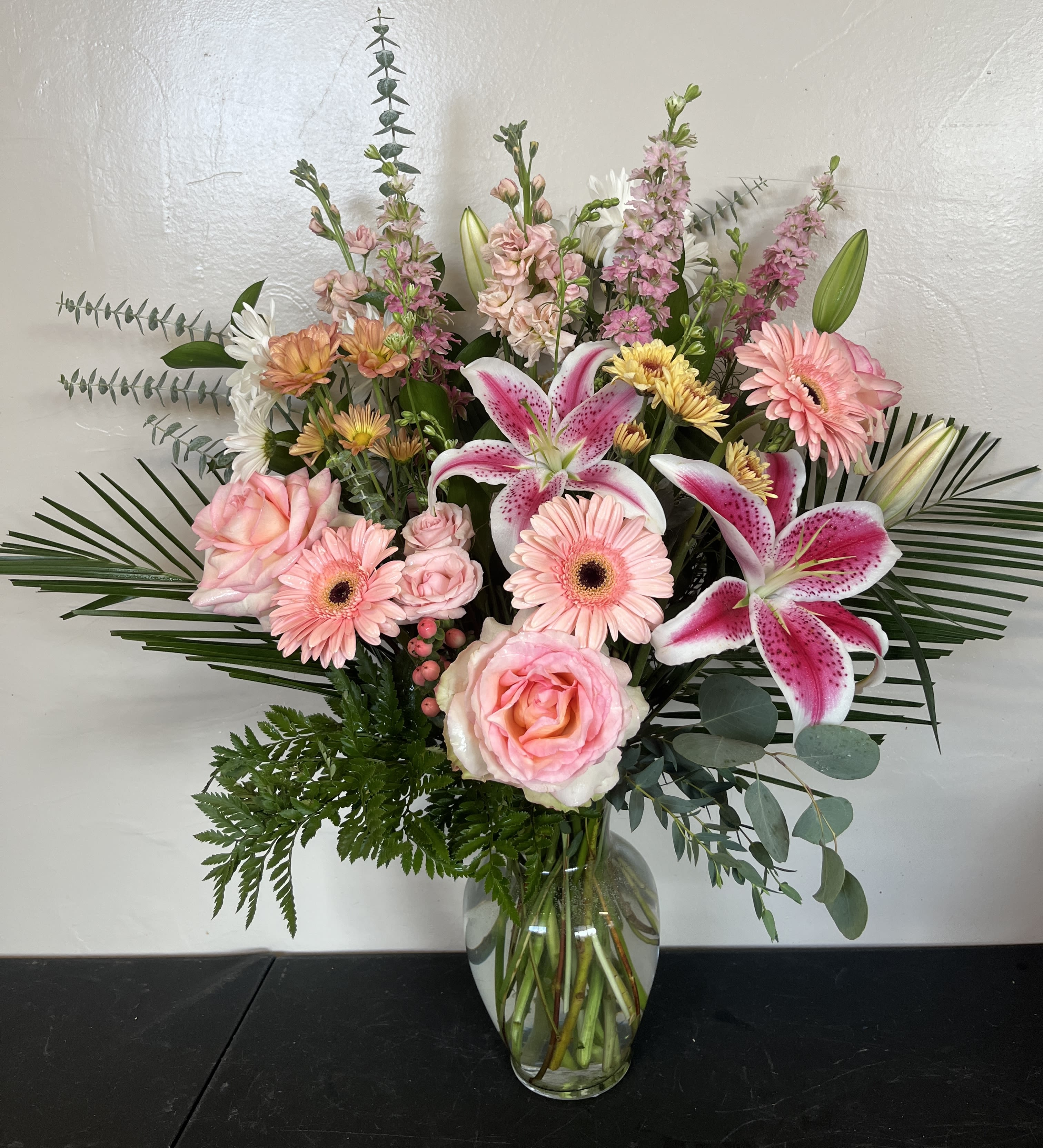 Pink and white mixed bouquet in a glass vase