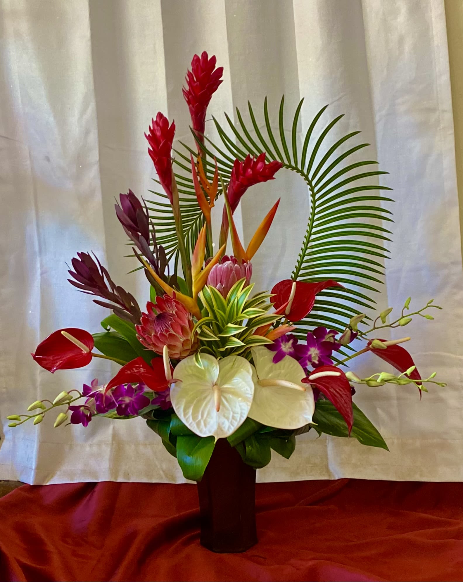  “Aloha Queen” High Style Tropical - Aloha Queen   New Winter  Design   HIGH STYLE DESIGN   TROPICAL  Gingers, anthuriums, orchids  heliconia  which are swirled by Sago or Areca palm  (swirl palm can change daily)        due  to  -  the invasive Coconut Rhinosaurus Beetle ....    apologies