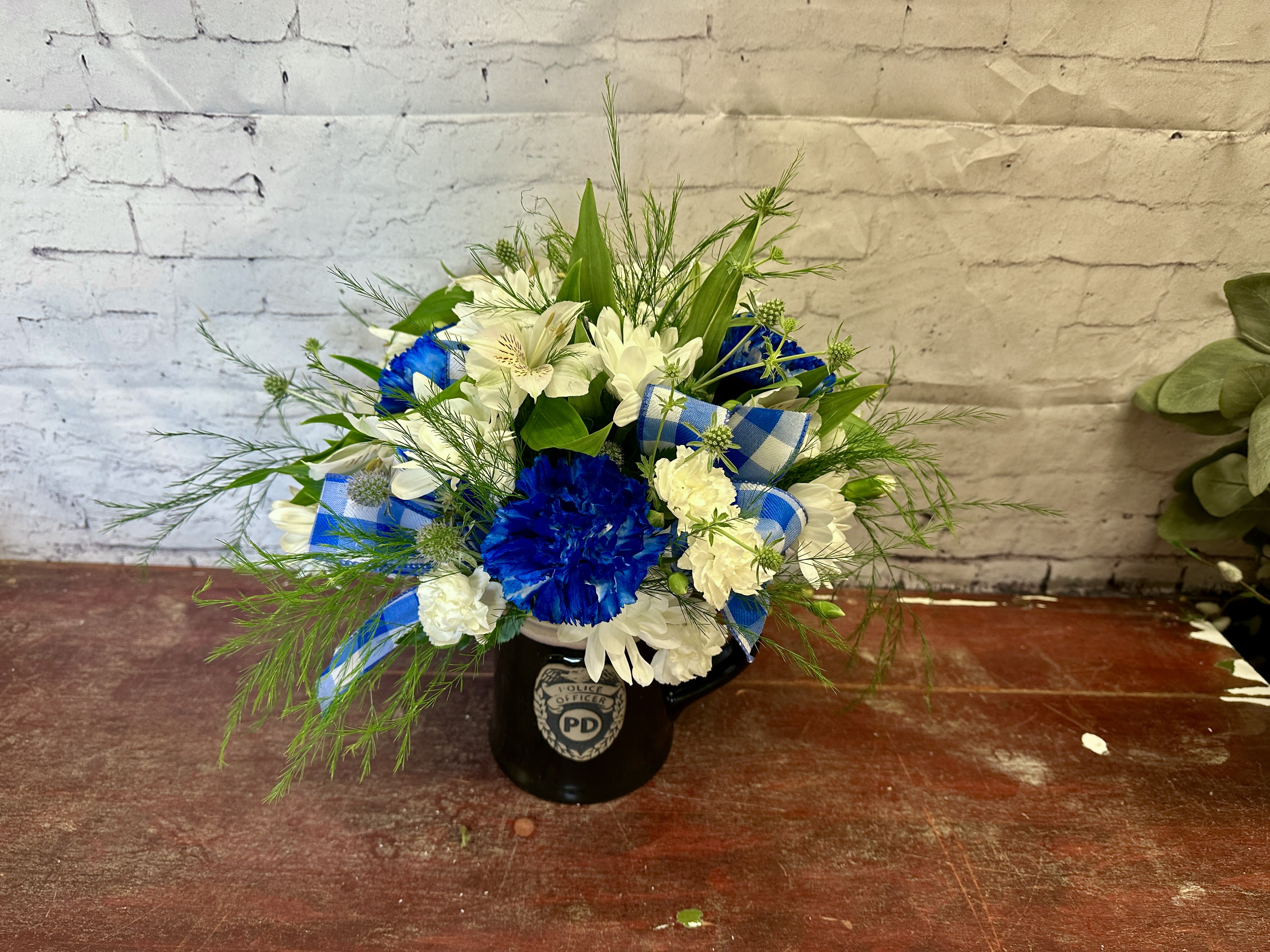 Blue line blooms - Black police department mug with white and blue mix of flowers for your favorite police department hero 