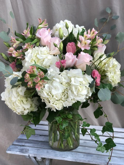 Pink and white bouquet in a glass vase