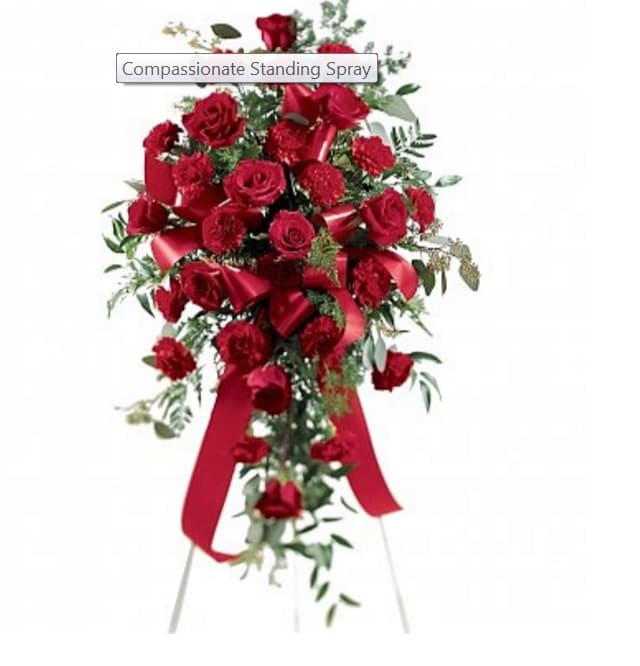 Red rose standing spray on an easel with ribbon