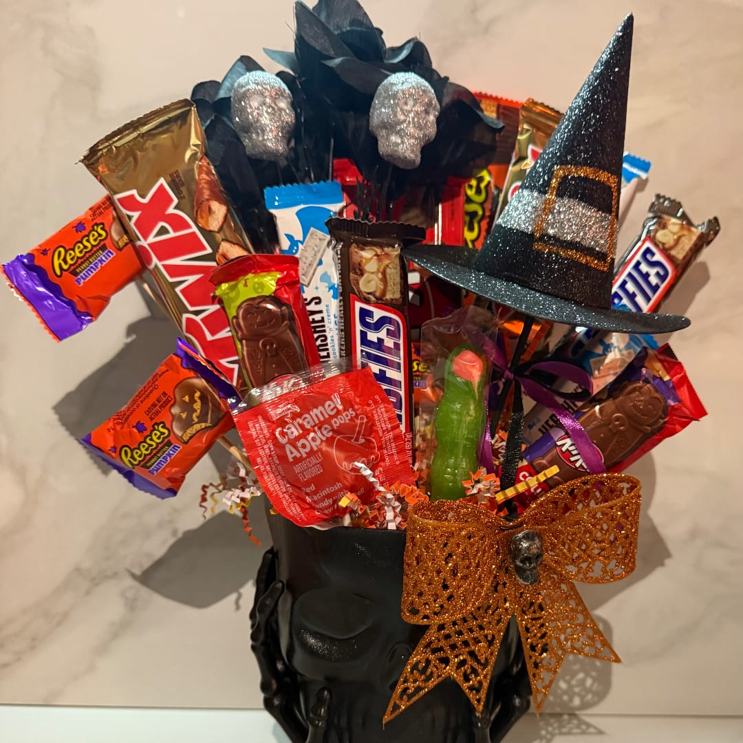 Halloween candy bouquet in a black skull vase with a witch hat and glitter bow