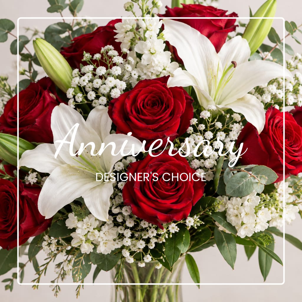Red roses and white lilies with baby's breath in a bouquet