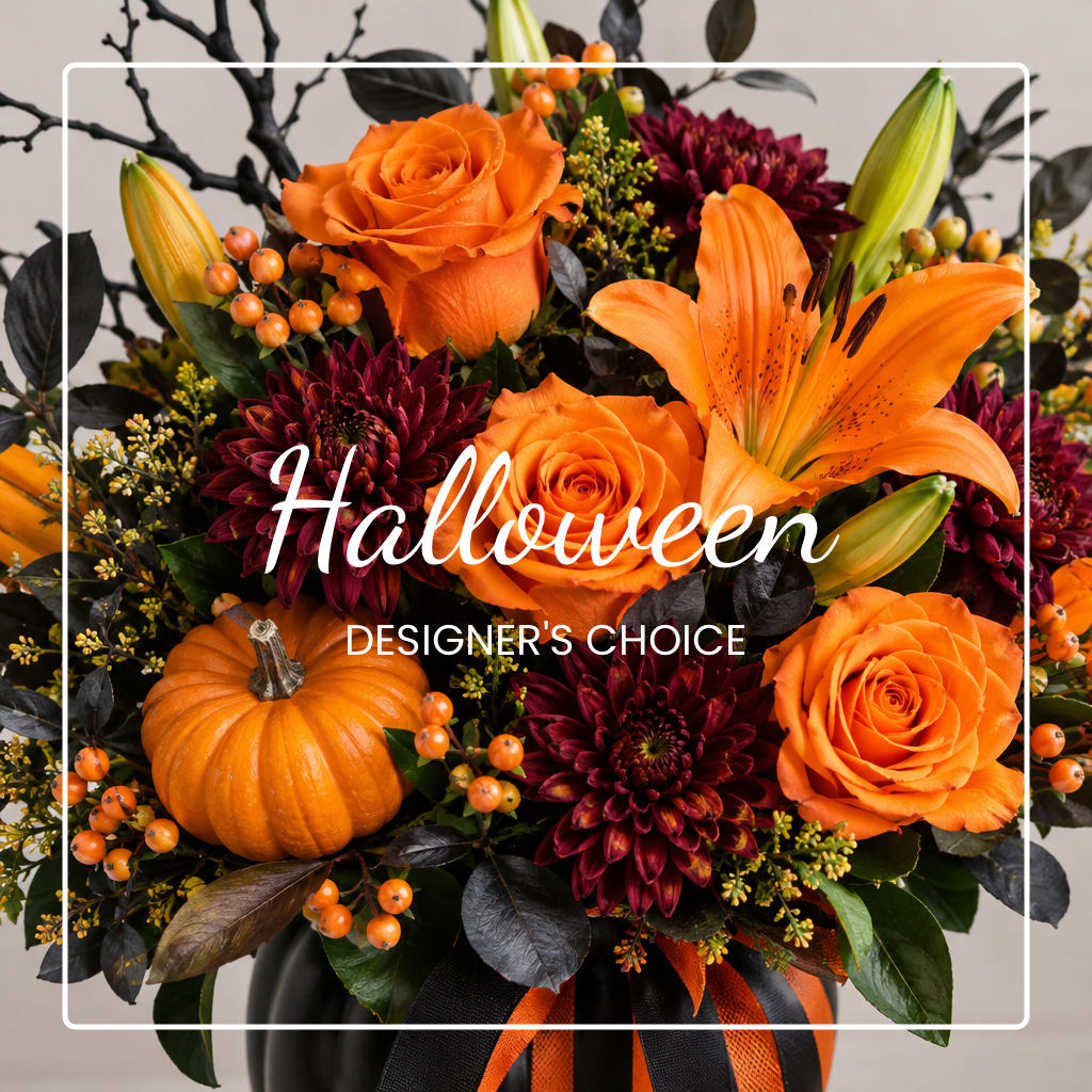 Orange roses and lilies with dark mums and a pumpkin in a vase