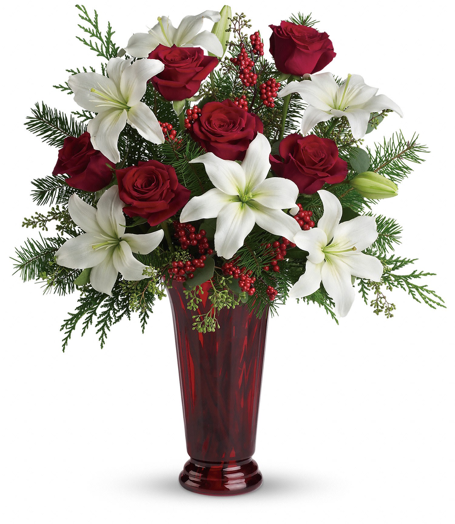 Holiday Magic - White asiatic lilies, red roses, fir, cedar and eucalyptus create the perfect holiday bouquet, especially when delivered in a stunning ruby red roman column vase. Approximately 20" W x 22 1/2" H