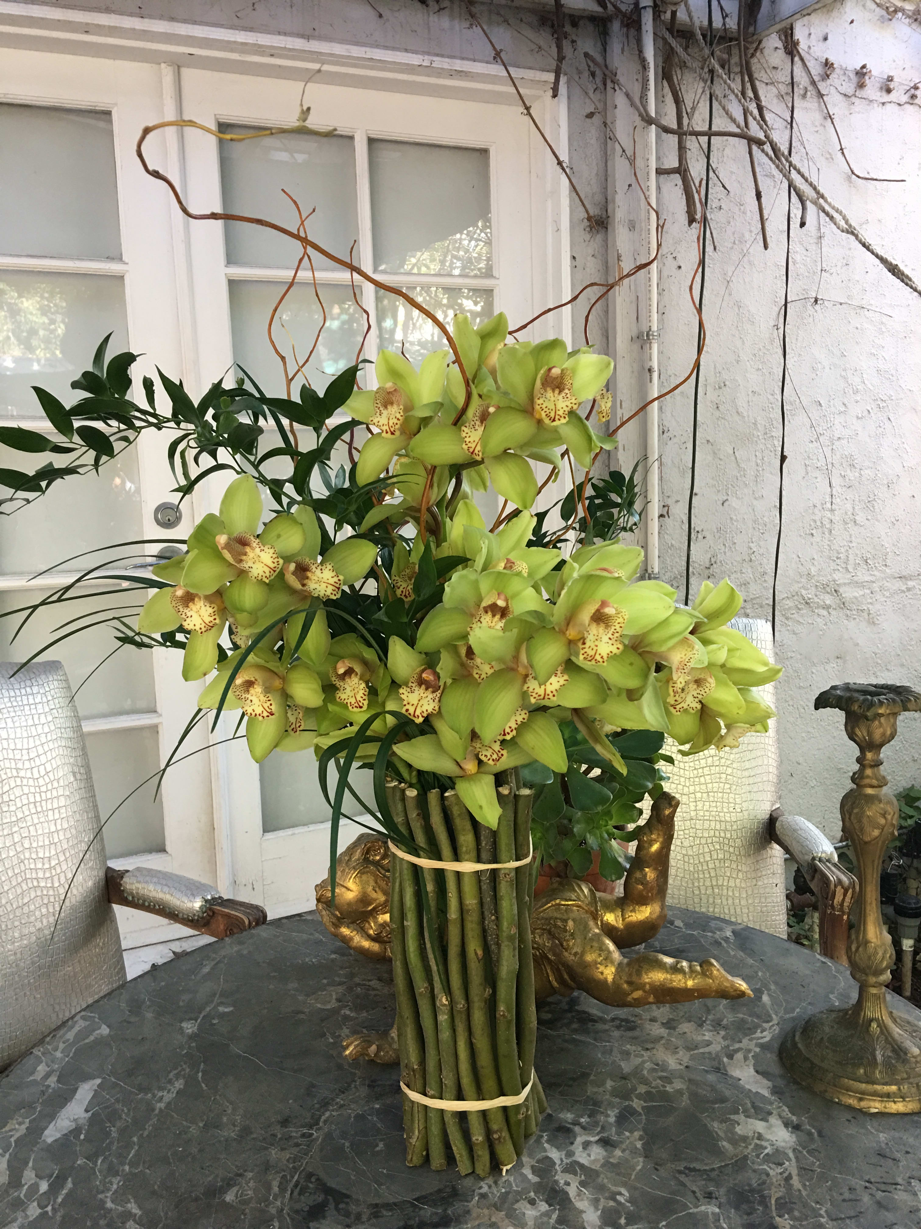Bouquet of green orchids with long stems in a bundled arrangement