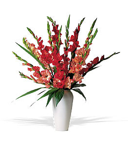 Tall red and peach floral arrangement in a white vase