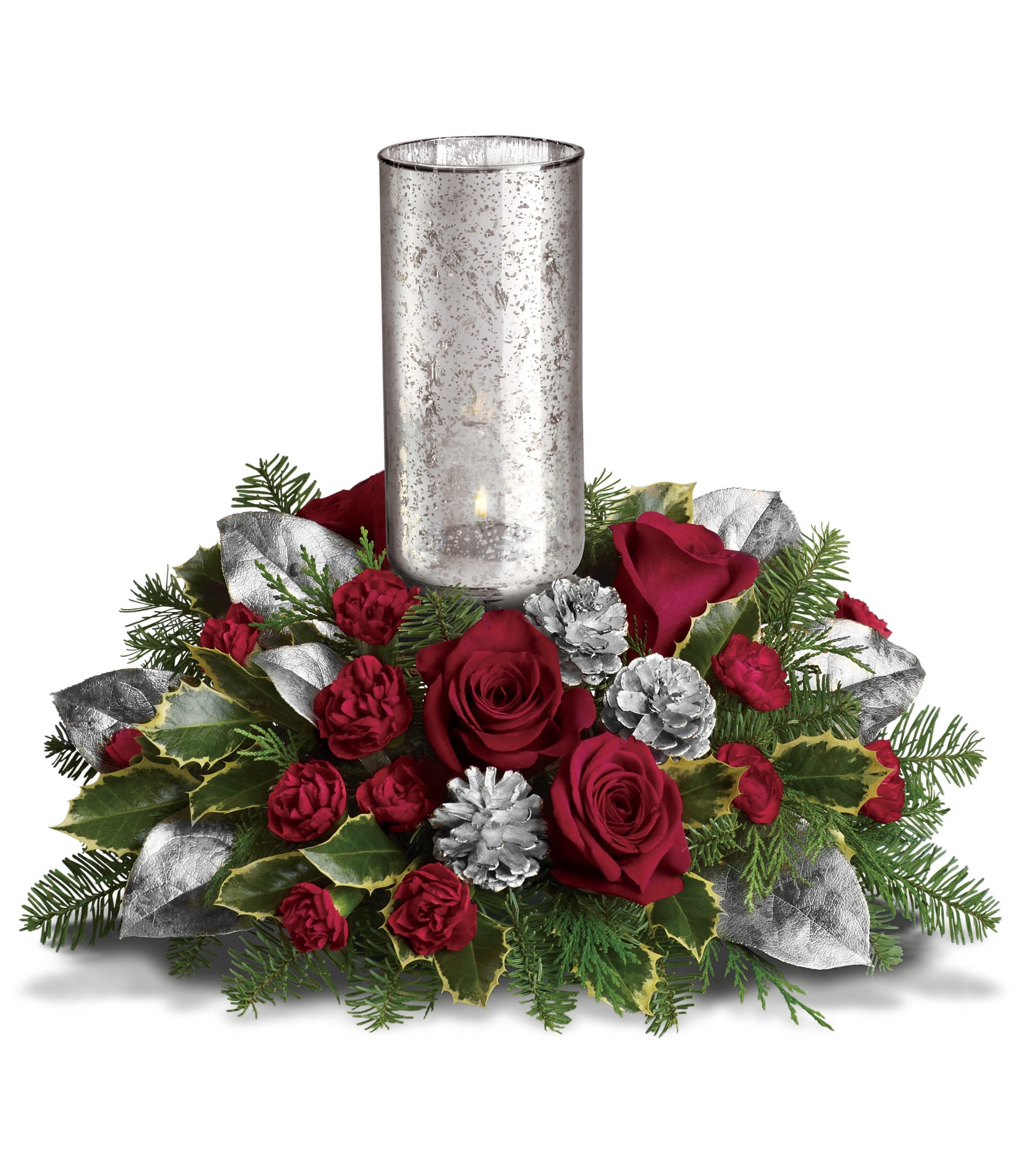 Teleflora's Silver Glow Centerpiece - Red roses, red miniature carnations, lemon leaf and tips of noble fir, holly and flat cedar are arranged to perfection. Delivered with a Silver Glow mercury glass hurricane. Approximately 15" W x 12" H.  T12X300A