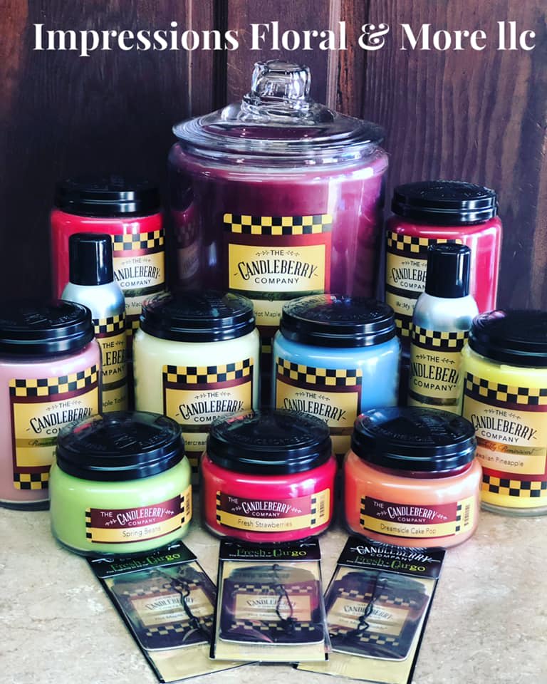 Assorted colorful candles and wax melts arranged in jars and packets