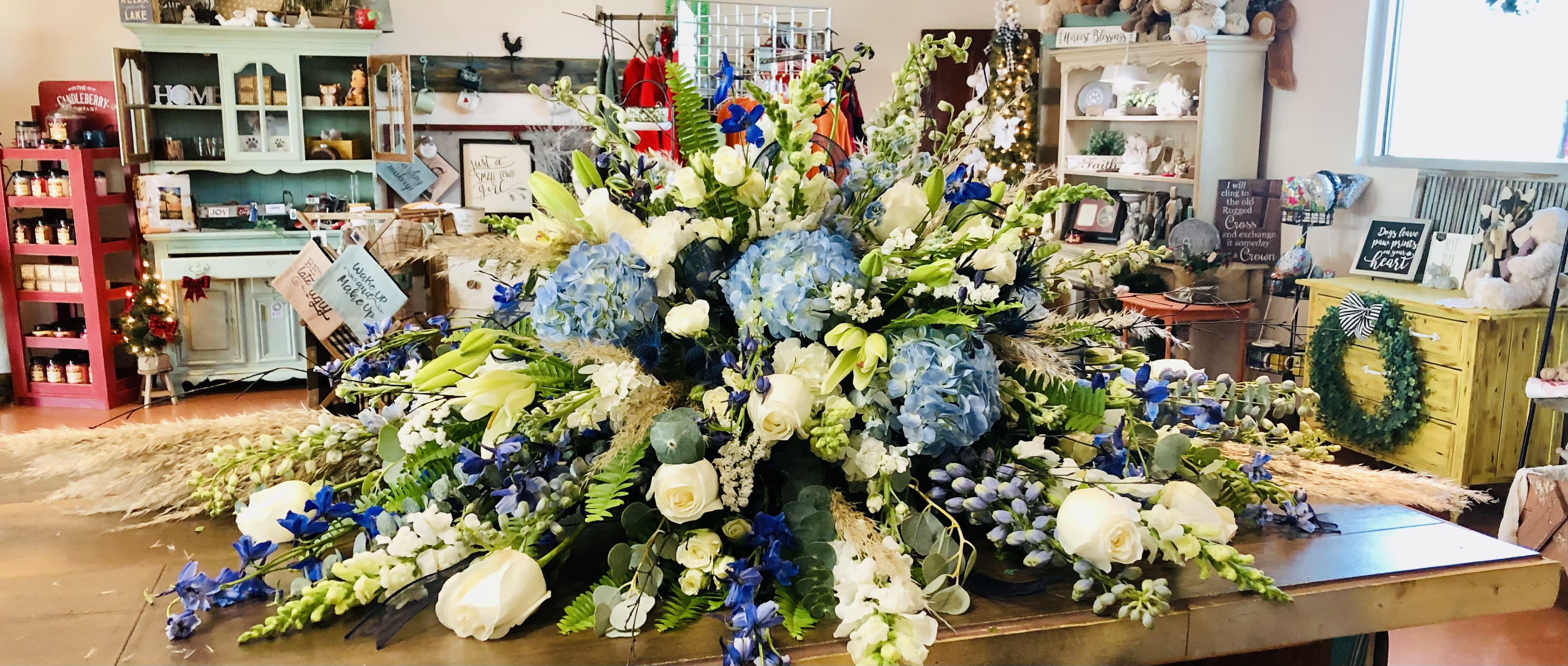 Large blue and white floral arrangement on a table