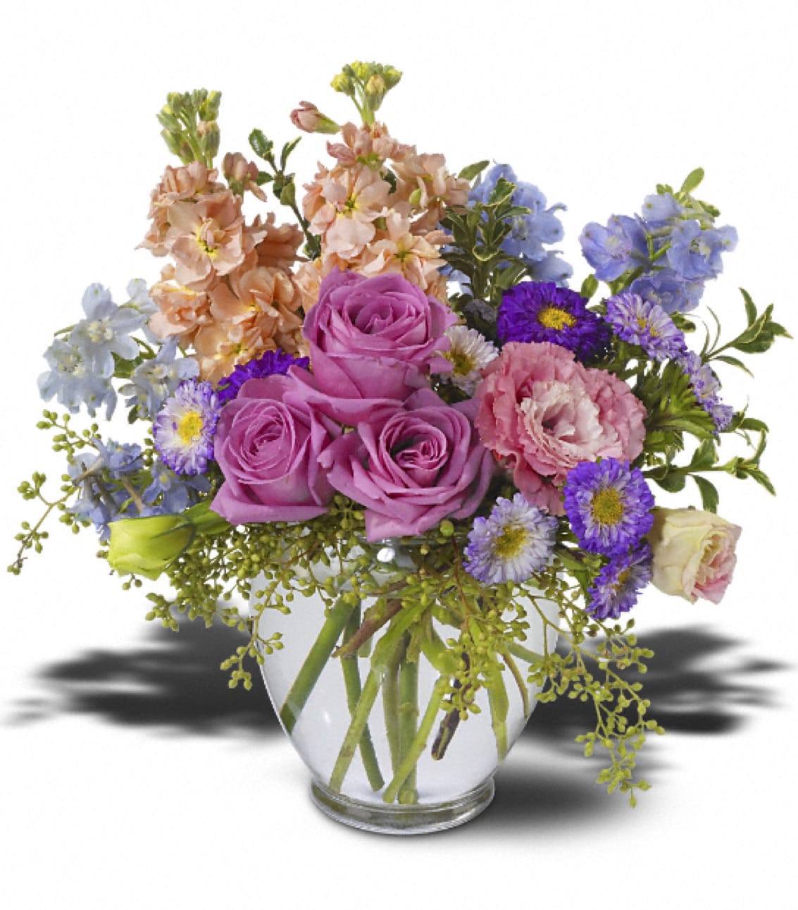 Teleflora's Heaven Scent - Pink stock and lisianthus, light blue delphinium, lavender roses and Matsumoto asters â accented with seeded eucalyptus and oregonia â are delivered in a clear glass vase. Approximately 11 (W) x 14 (H)