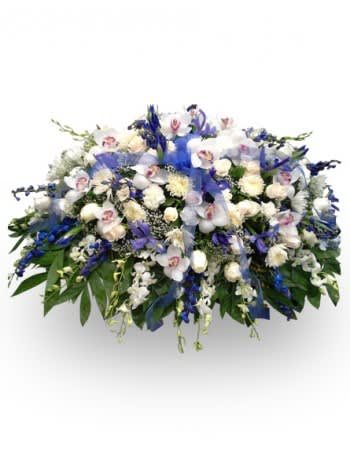 Large white and blue floral spray with orchids and lilies