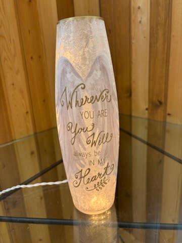 Decorative glass candle holder with a printed quote
