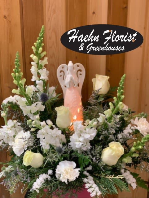Angel in the Clouds  - White Angel – All White Flower Arrangement ***ANGEL MAY VARY  Bring elegance, peace, and timeless beauty into any space with our White Angel in All White Flower Arrangement, thoughtfully designed by Haehn Florist &amp; Greenhouses in Wapakoneta, Ohio. This stunning arrangement features a graceful mix of fresh white flowers, symbolizing purity, love, and serenity. Perfect for sympathy gestures, memorial services, weddings, or as a sophisticated gift to brighten someone’s day, this all-white floral design offers a heartfelt way to express your emotions.  At Haehn Florist &amp; Greenhouses, 410 Hamilton Rd., Wapakoneta, OH 45895, our experienced floral designers create each White Angel arrangement with care and artistry, ensuring your gift arrives fresh and beautiful.  Whether you are sending comfort, celebrating a milestone, or adding a touch of elegance to your home, the White Angel arrangement is a timeless choice. Same-day delivery is available in Wapakoneta and surrounding areas.  Order the White Angel in All White Flower Arrangement today from Haehn Florist &amp; Greenhouses and let the beauty of flowers share your message of love and remembrance.