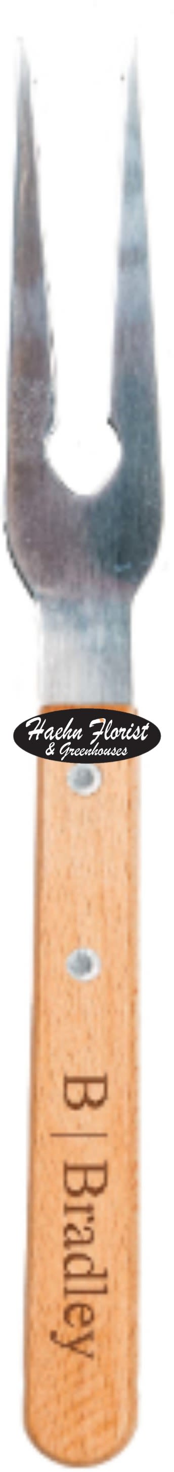 Wood-handled garden fork with metal tines and a florist logo sticker
