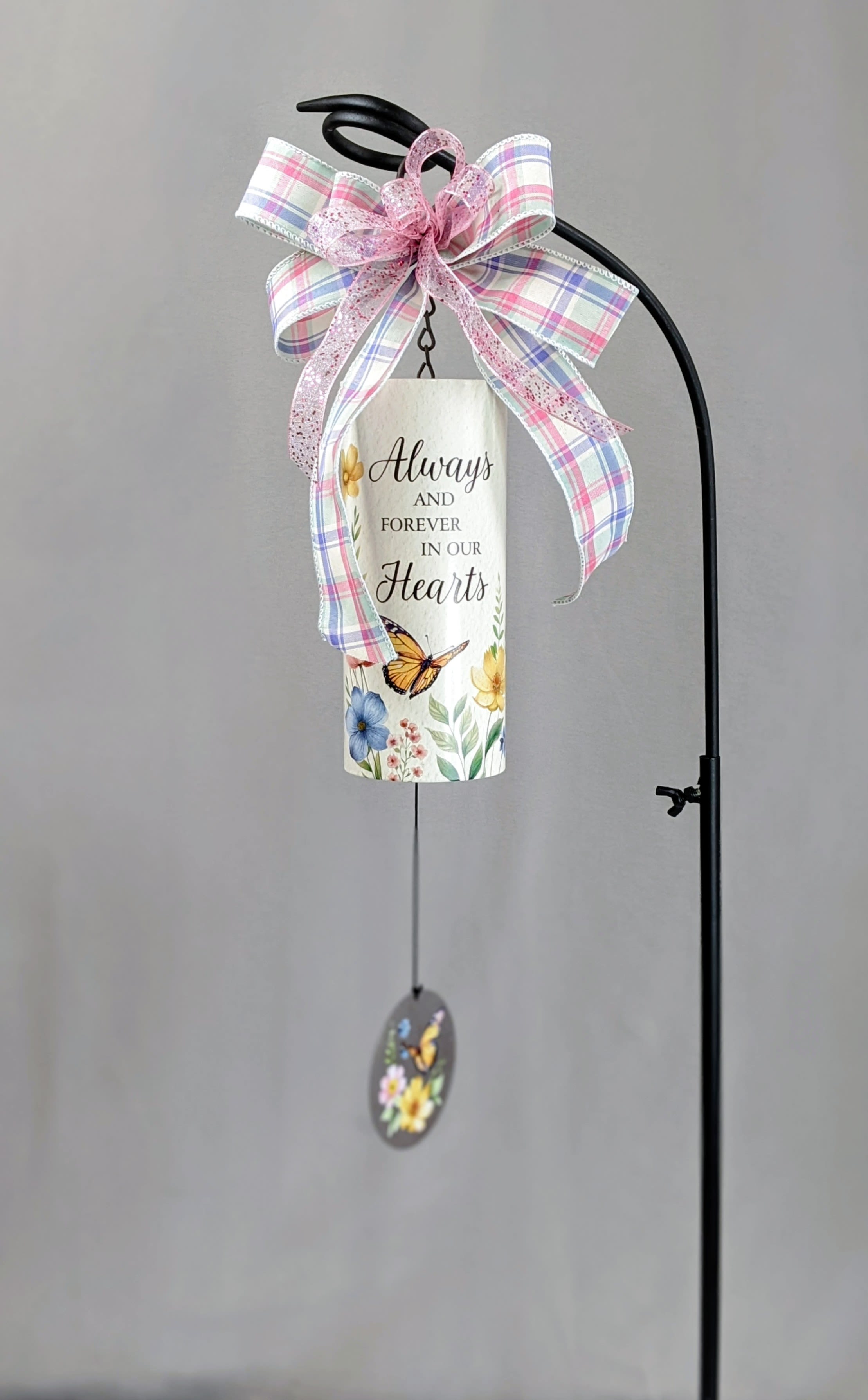 Decorative hanging memorial sign with a plaid bow and butterfly charm