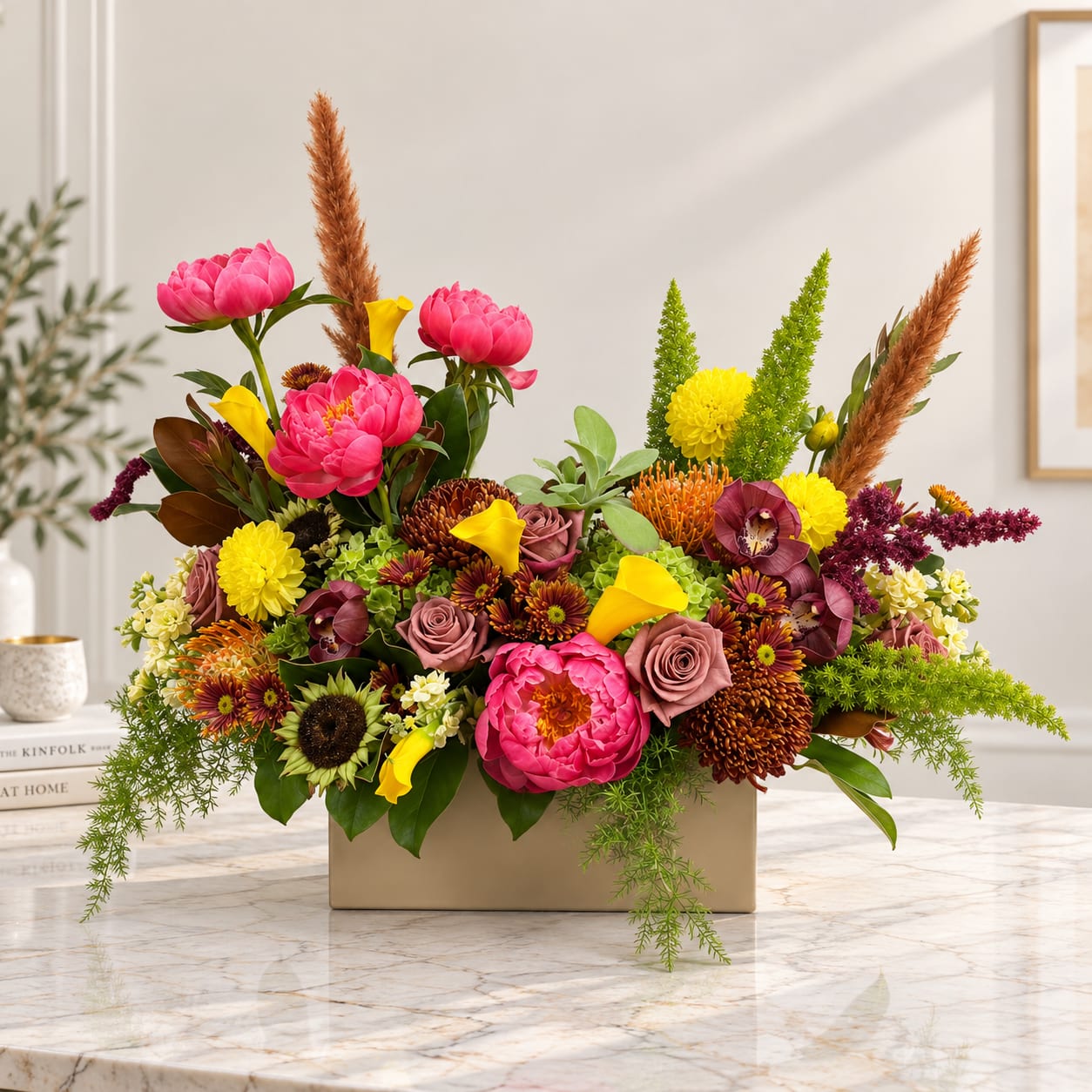 Colorful floral arrangement in a rectangular beige vase with pink, yellow, and burgundy blooms