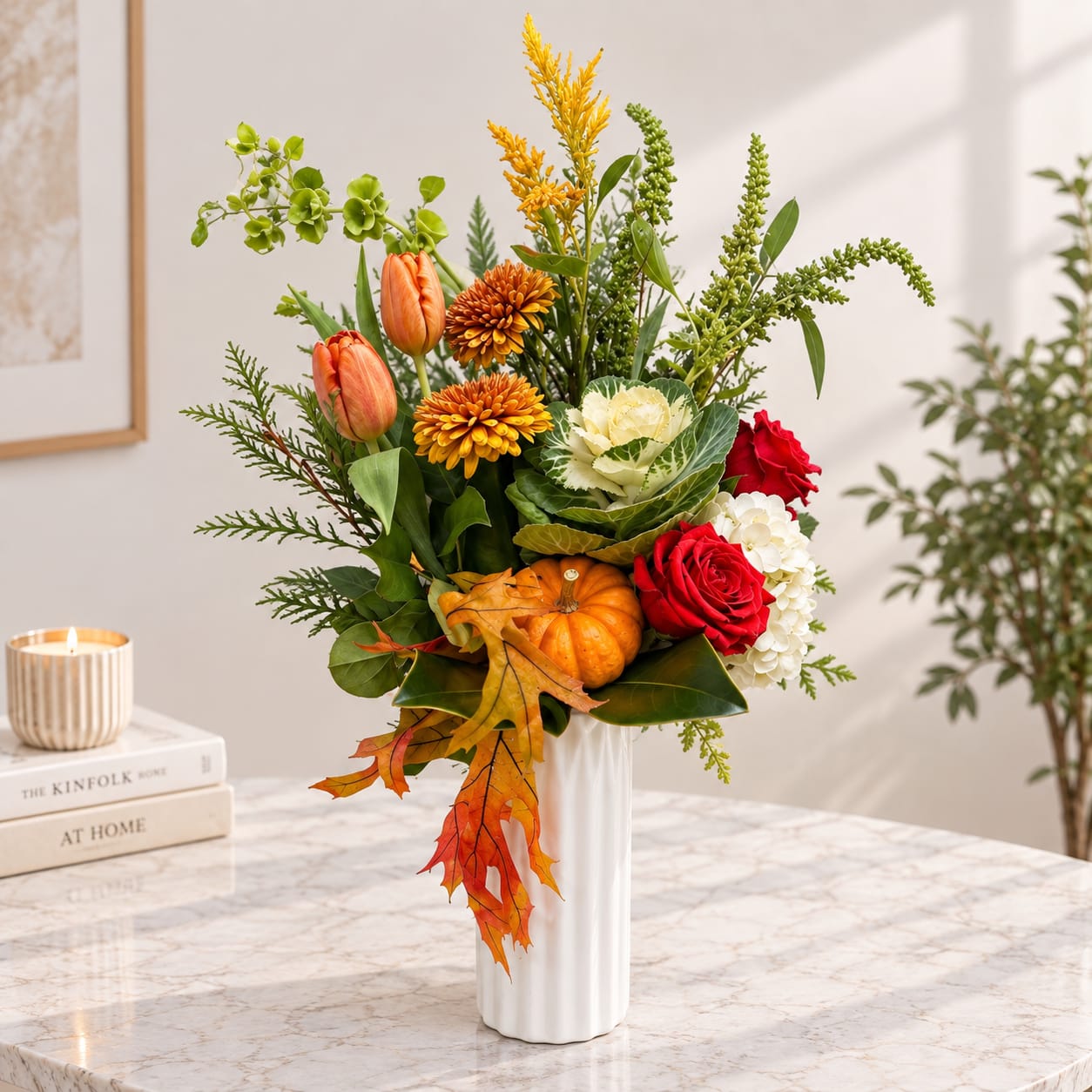 Autumn bouquet in a white vase with orange tulips, red roses, and pumpkins