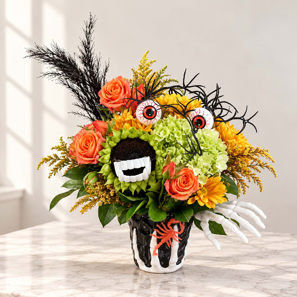 Halloween bouquet with orange roses, yellow flowers, and spooky decorations in a black vase