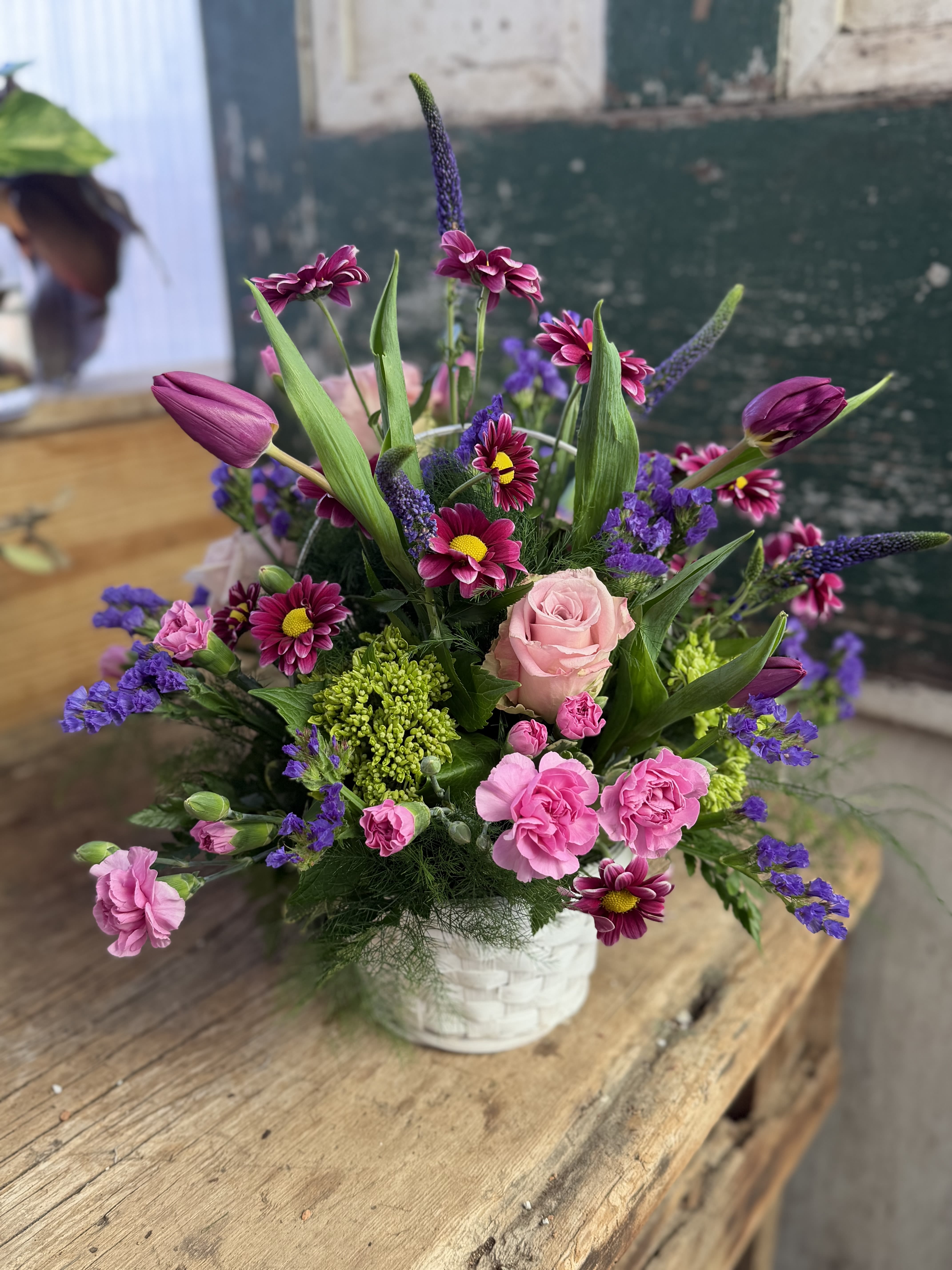The Greeting Basket - Lavender and lovely, our fresh-packed Greeting Basket features alstroemeria, roses, daisies, mums and more!
