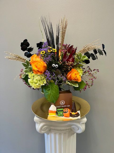 Trick Or Treat - The ultimate Halloween treat! Our Witches Brew arrangement accompanied by 4 Sweet Shop truffles, a witches hat, monster, ghost, and jack-o-lantern. 