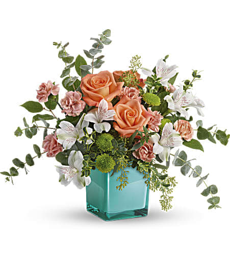 Teleflora's Sunset Splash Bouquet - Inspired by the warm peach skies and crystal blue waters of a tropical sunset, this fun-filled rose bouquet adds a splash of happiness to any occasion! 