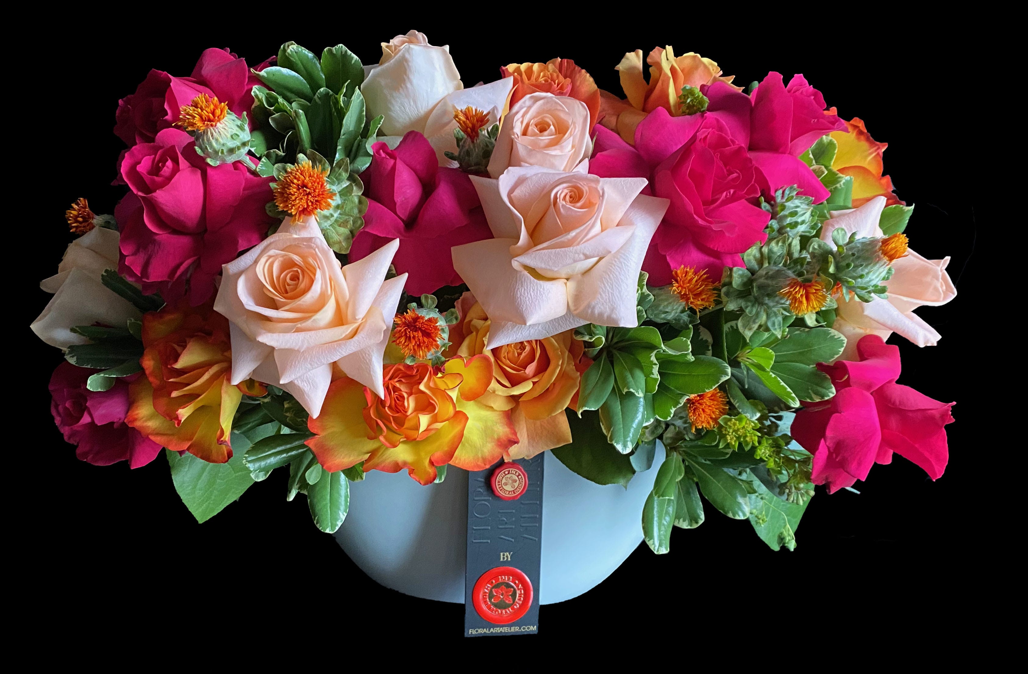 Mixed roses in a light blue hatbox-style container