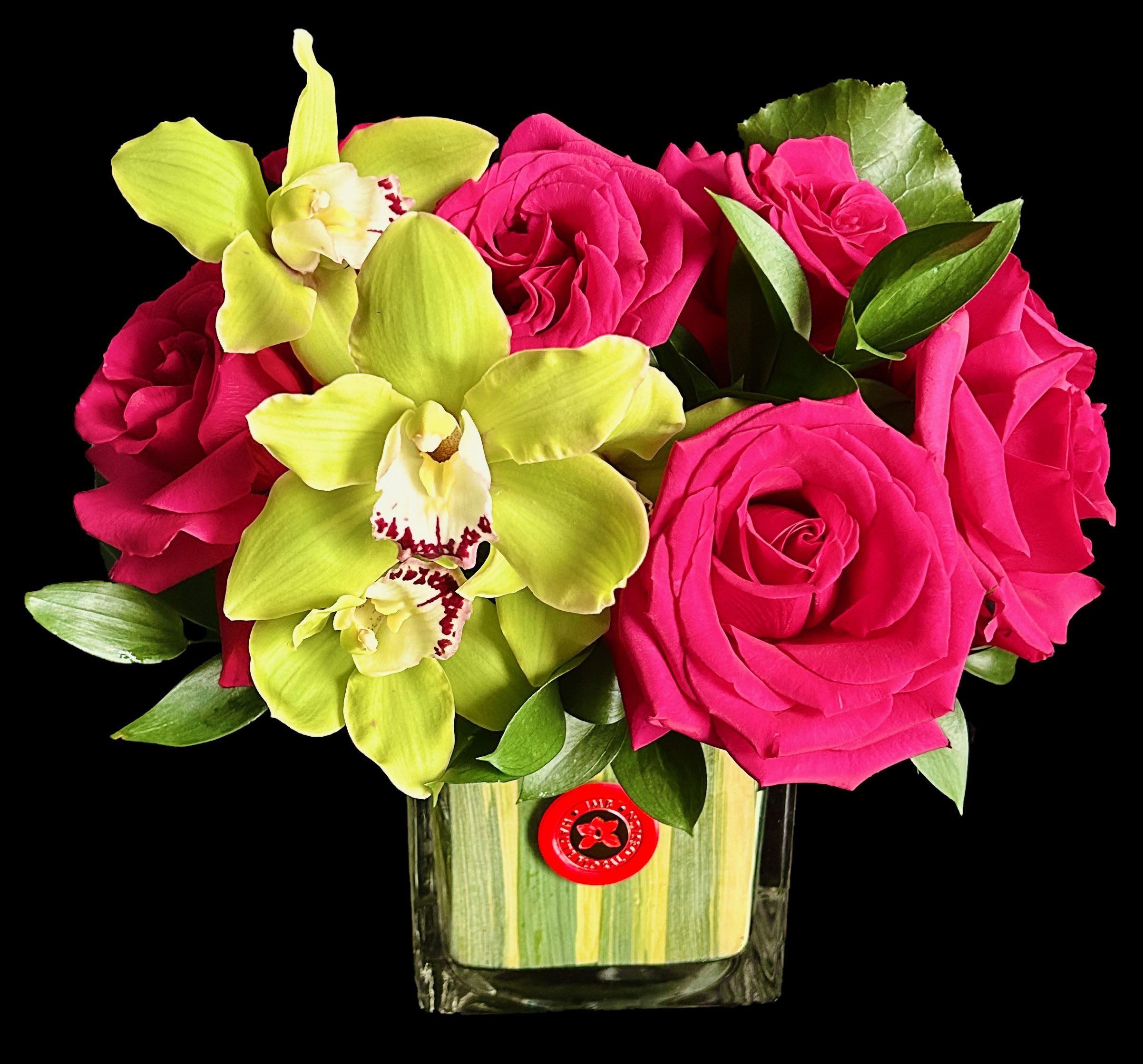 Bright Cube - Bright roses and Orchids in lined glass cube.