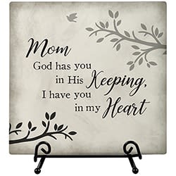 Decorative memorial plaque with the words "Mom God has you in His Keeping"
