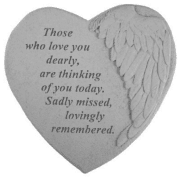 Heart-shaped memorial plaque with angel wings and sympathy text