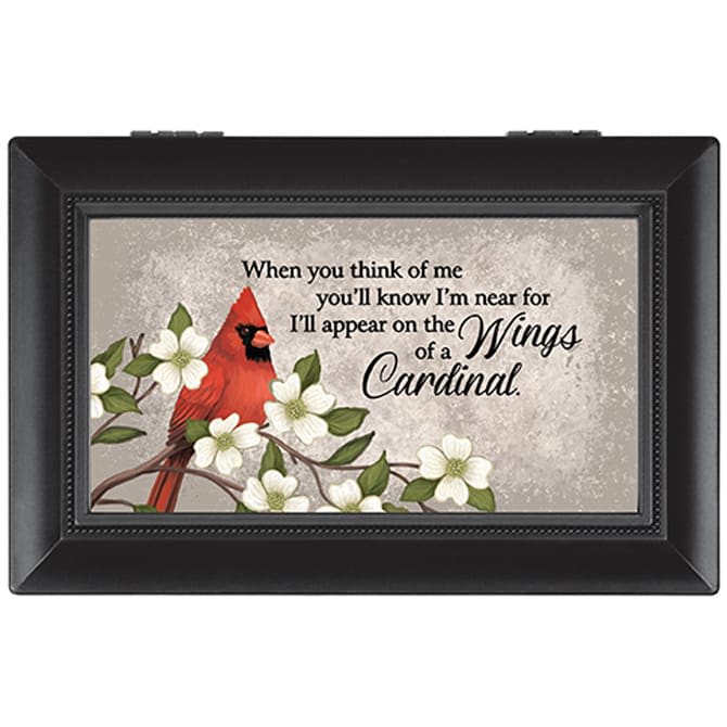 Framed memorial plaque with a cardinal and white flowers