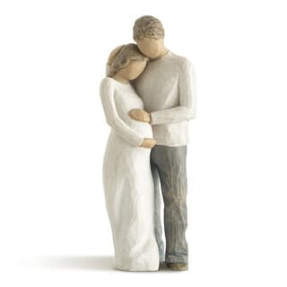 Carved figurine of a couple embracing