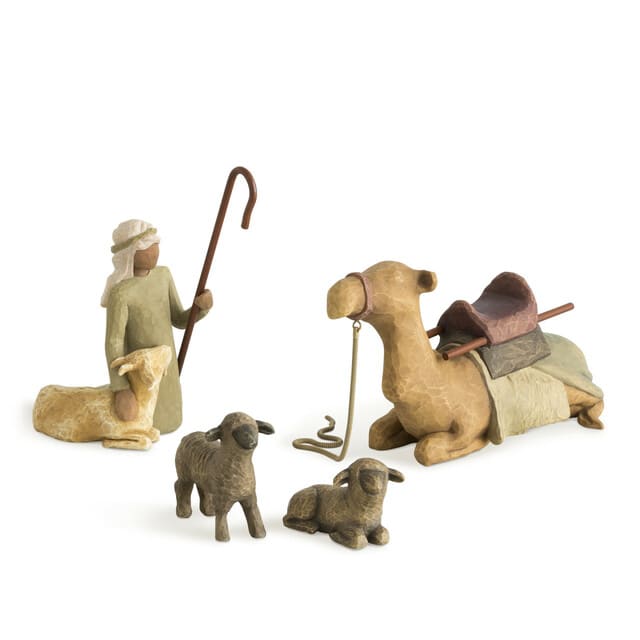 Nativity figurines with a shepherd, camel, and sheep