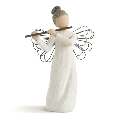 Wooden angel figurine holding a flute
