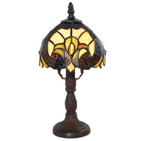 Stained glass table lamp with a dark base and yellow shade