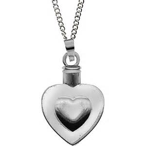 Heart-shaped silver pendant necklace with a small vial charm