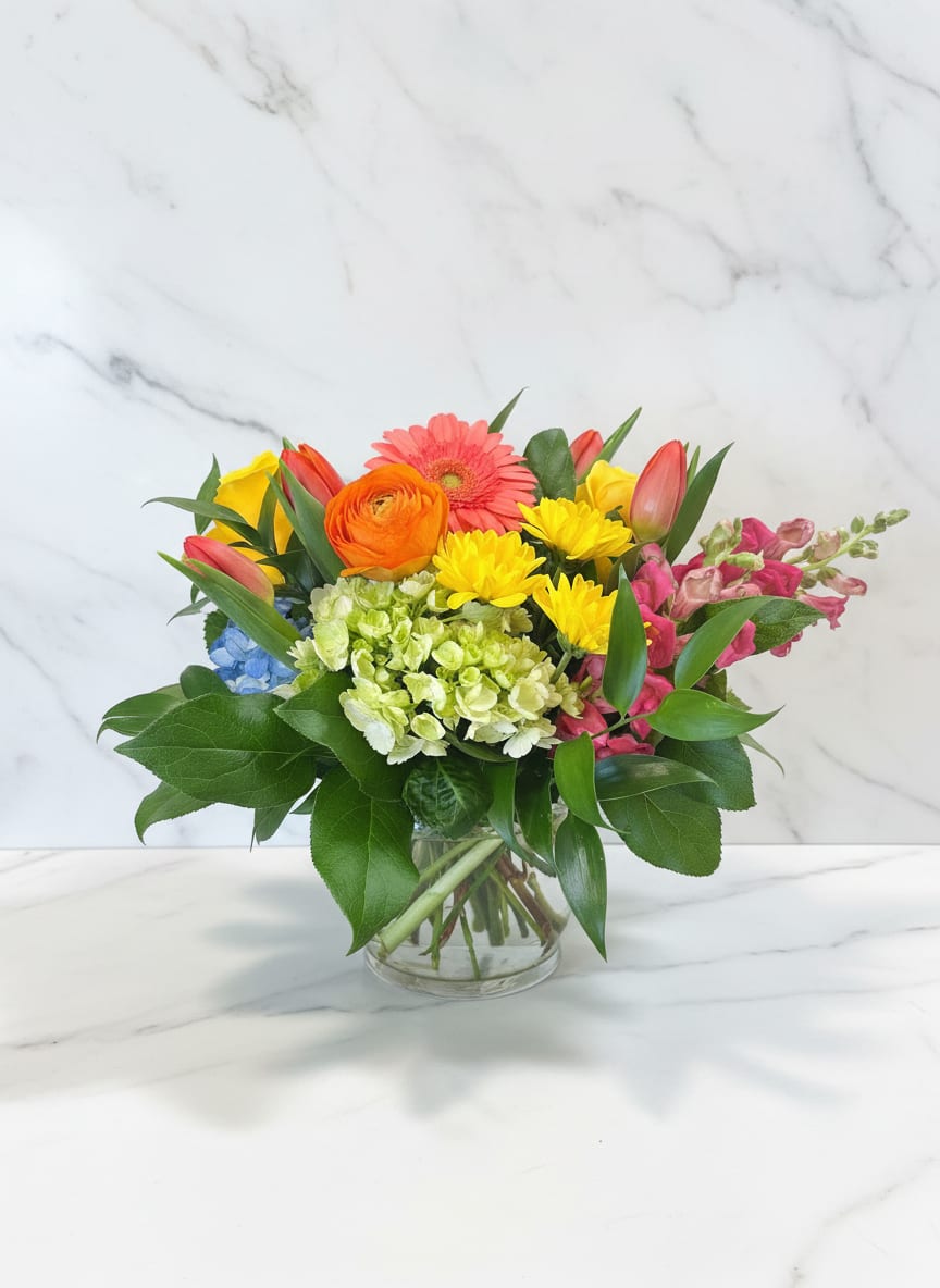 THE BRIGHT JASMINE - Just picked from the garden flowers in a cylinder or cube vase. We will use the freshest, most beautiful blooms that we have in shop! If you have a color or flower preference, please let us know.  