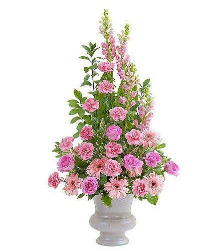Pink flowers arranged in a tall gray vase
